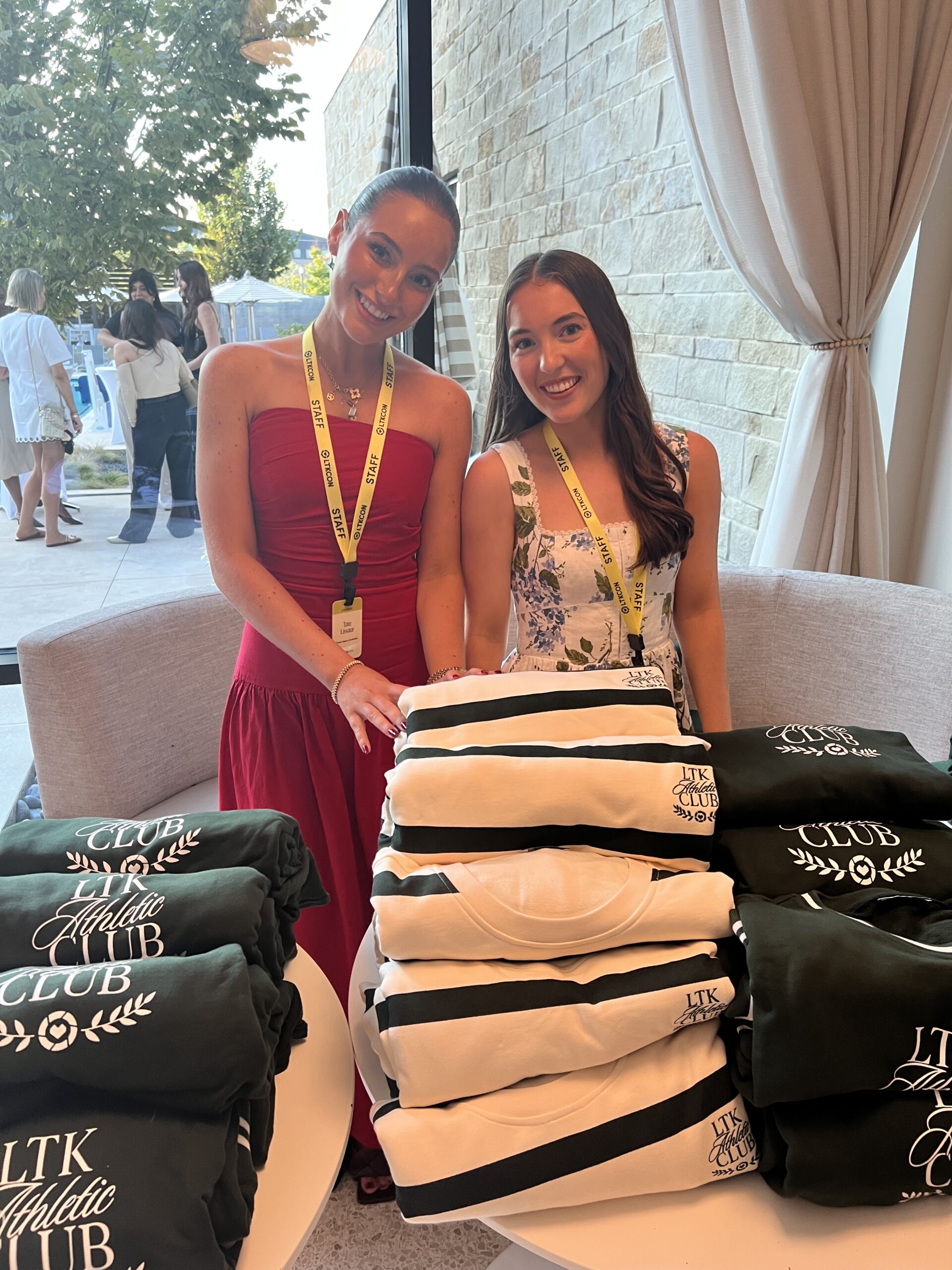 LTK Vendors and LTK Sweaters at the merch table.