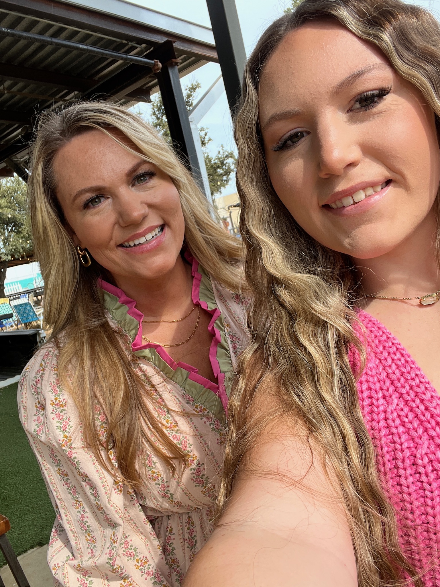 Audrie Dollins smiling with her daughter at The Mom Game Live event at Truck Yard Fort Worth, celebrating a special evening supporting Susan G. Komen for breast cancer awareness.